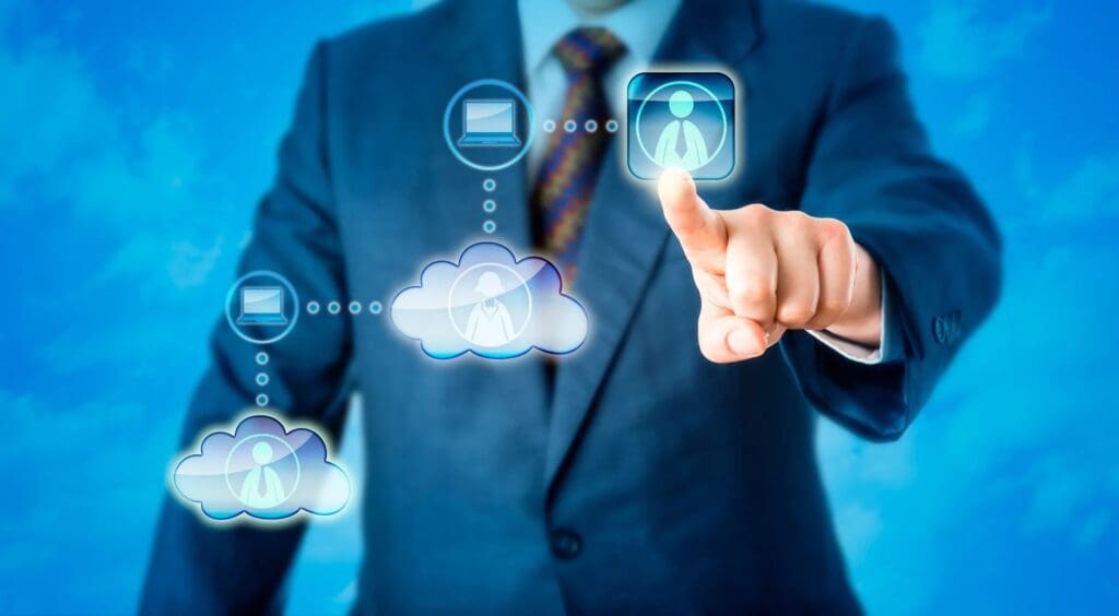 A man in a suit and tie touching an image of the cloud.